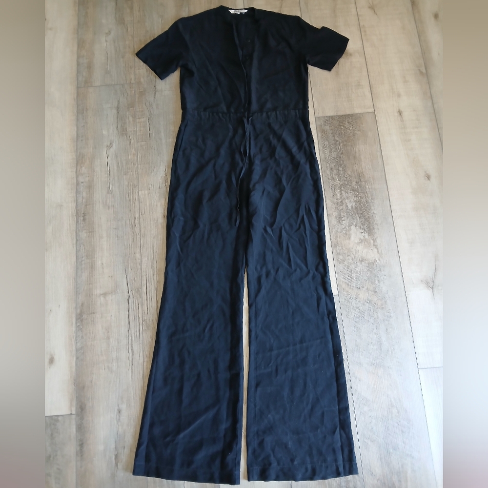 Tucker silk jumpsuit in black. Size XS